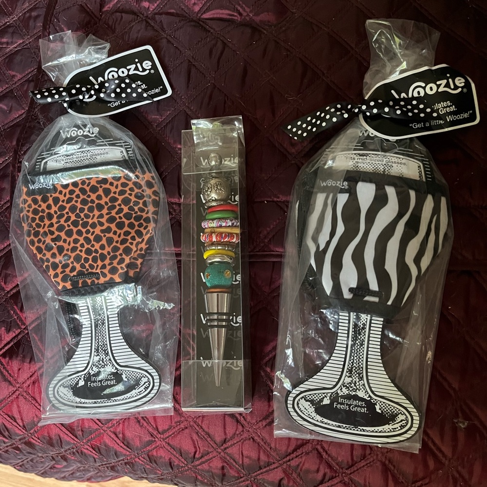 Two woozie drink jackets and a wine bottle stopper